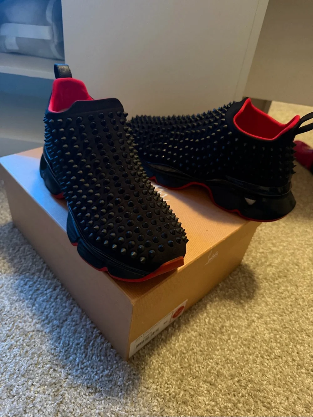 Christian Louboutin Black and Red Spike-Embellished Slip-On Sneakers